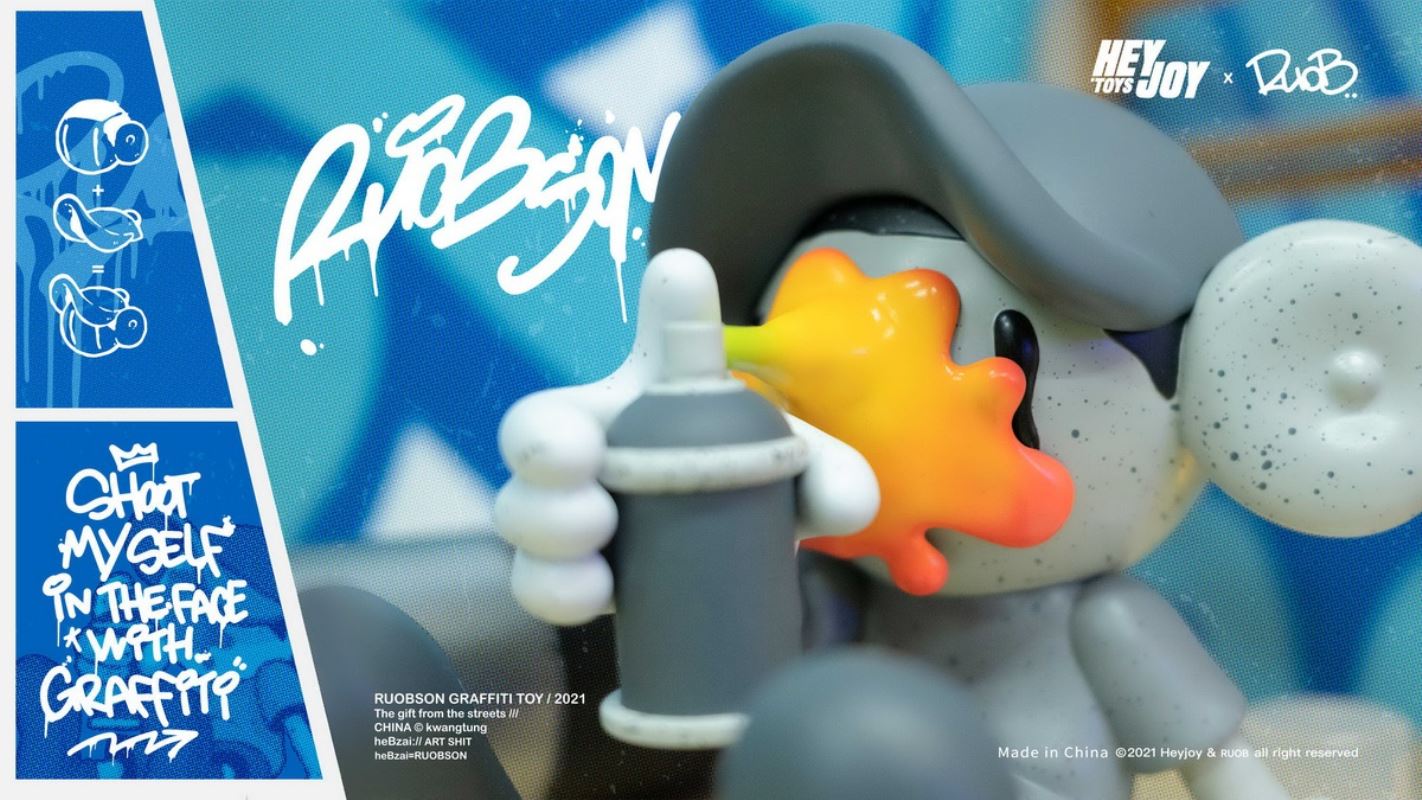 He B shoots his own face with spray paint trendy doll