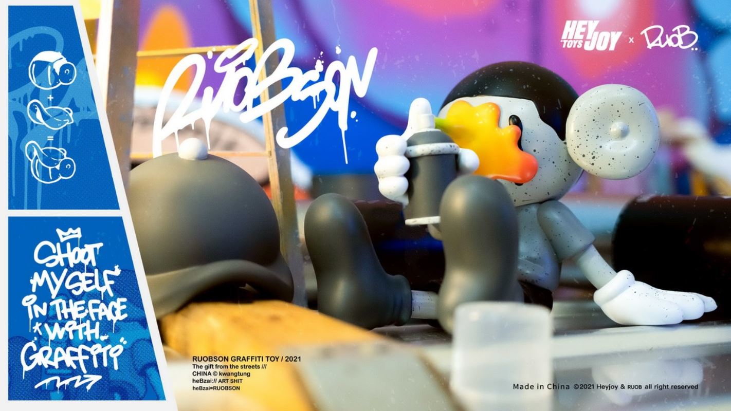 He B shoots his own face with spray paint trendy doll