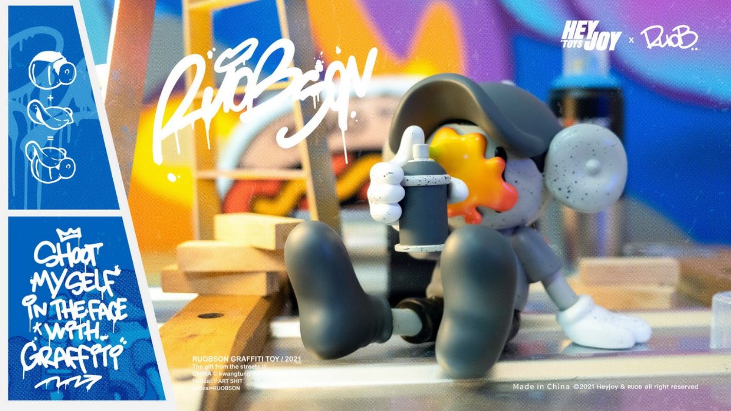He B shoots his own face with spray paint trendy doll