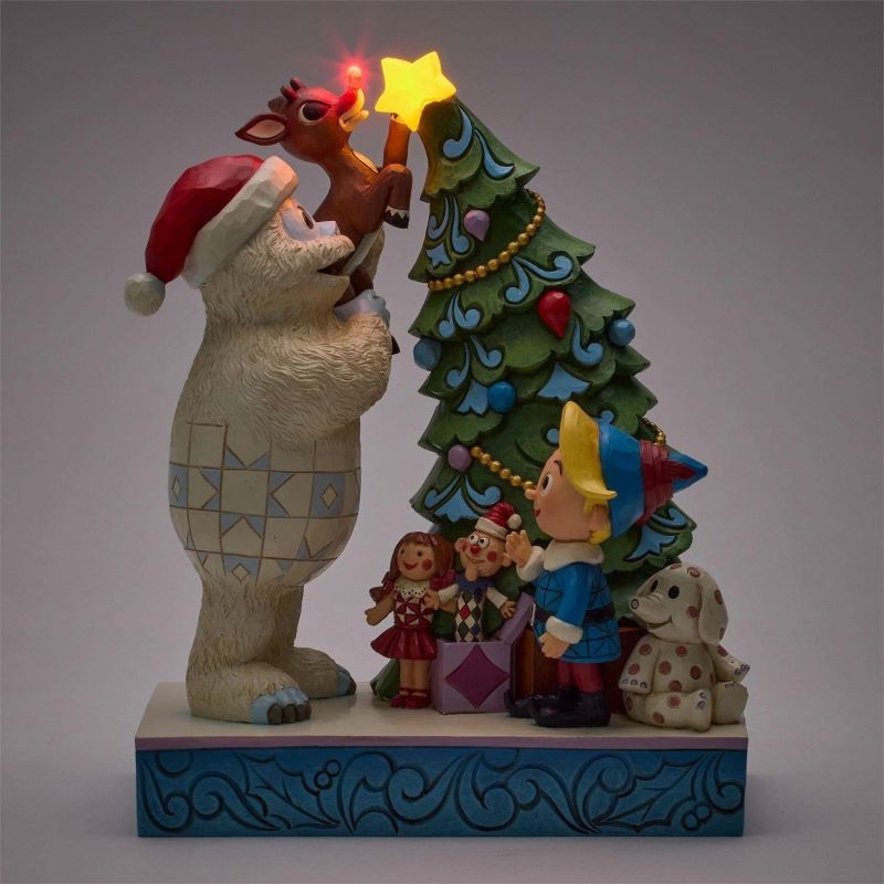 Bumble Holding Rudolph by Tree