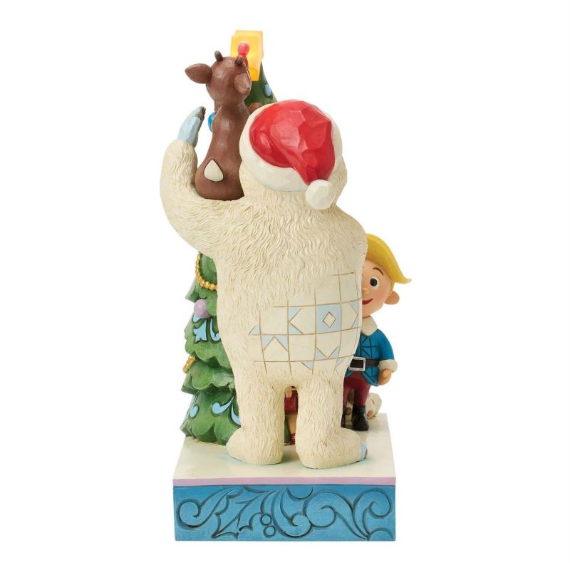 Bumble Holding Rudolph by Tree