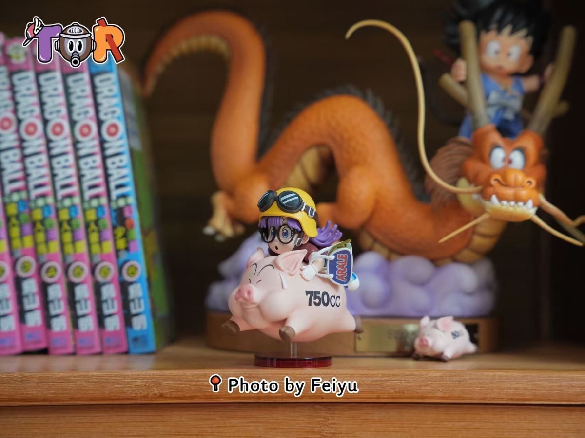 Arale riding a Pig