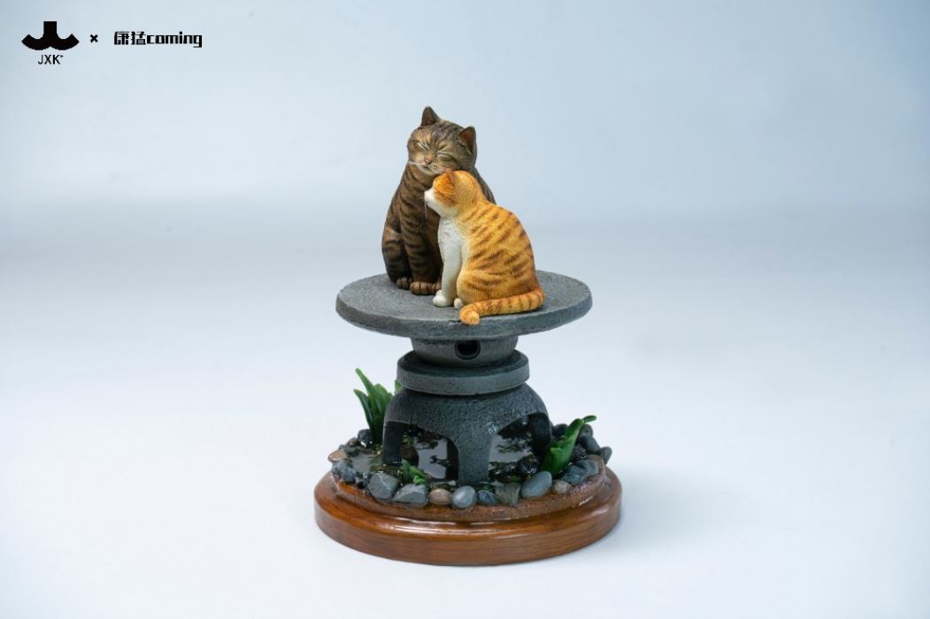 Cats Resting Among Stones