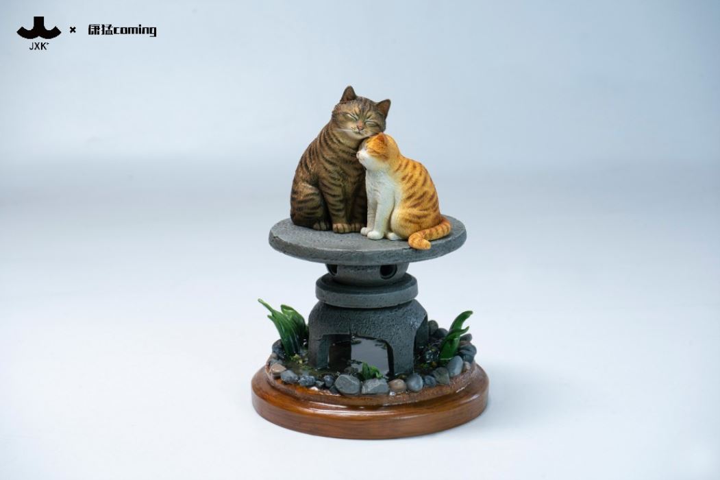 Cats Resting Among Stones